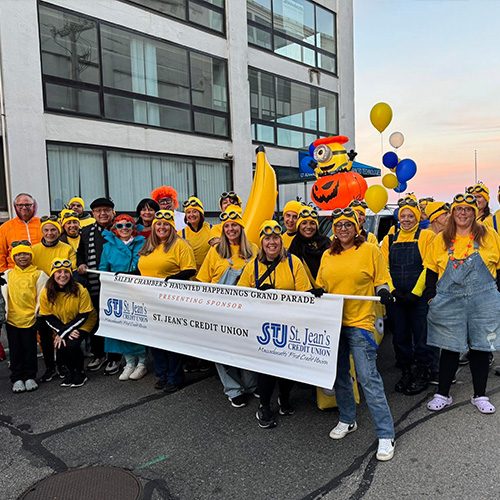 STJCU staff members dressed up as Minions at a parade